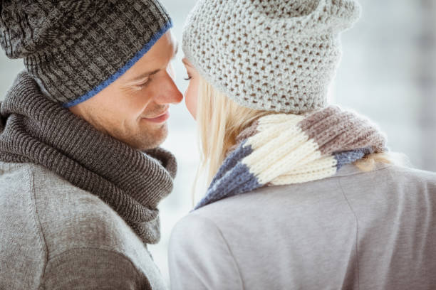 istock Couple in warm clothing facing each other 692479822