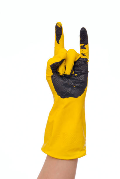 istock Yellow latex glove 692482302