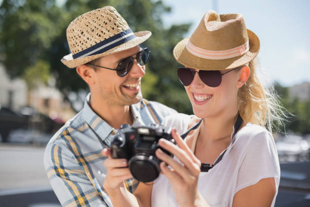 istock Hip young couple looking at their camera 692482774