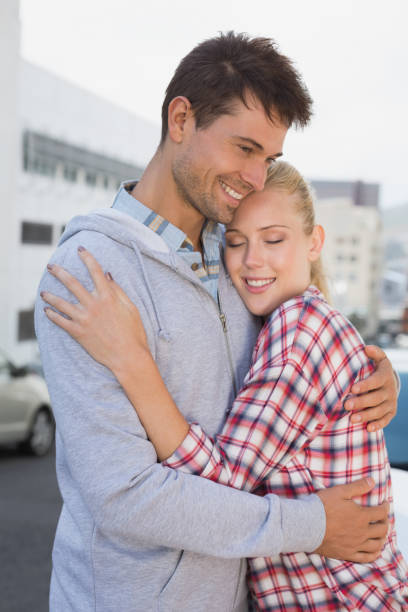 istock Hip young couple hugging in the road 692484132