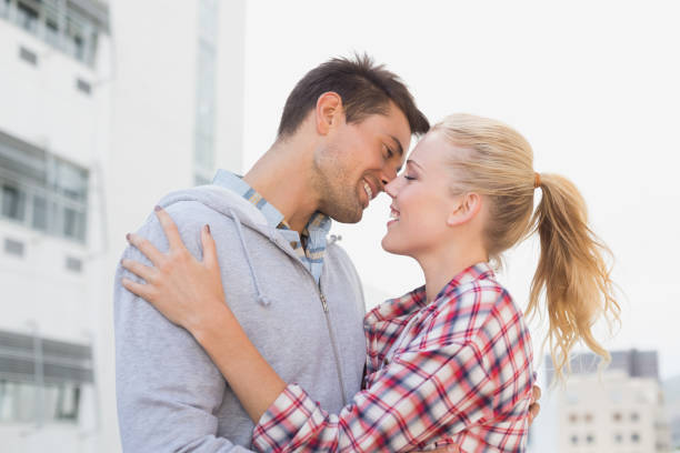 istock Hip young couple hugging about to kiss 692485674