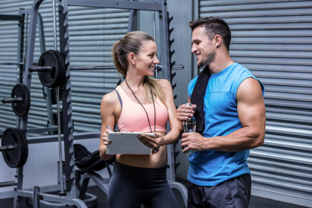 istock Young woman smiling at a young man 692485894