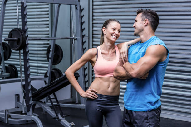 istock Young woman smiling at the young man 692486040