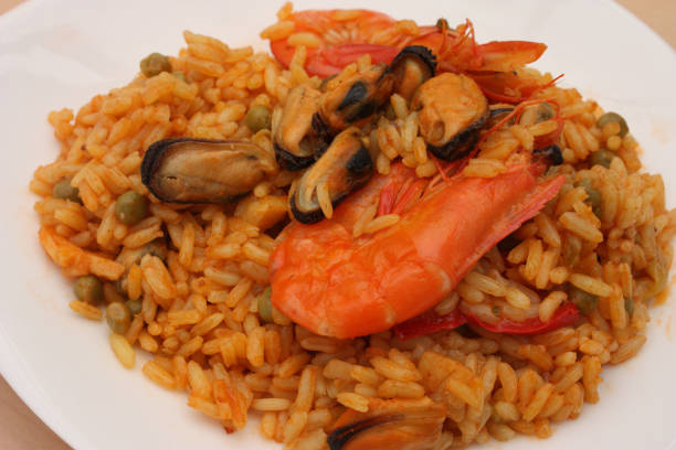 istock Rice saffron with seafood: mussels shrimp 692495440