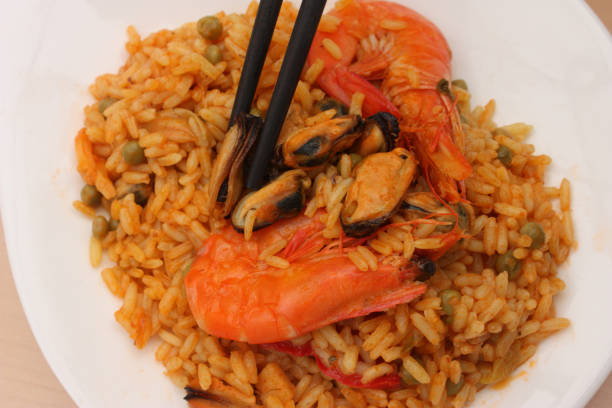 istock Rice saffron with seafood: mussels shrimp 692495660