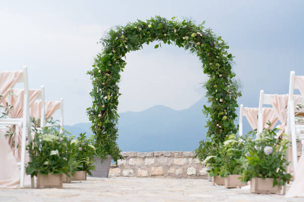 decorated arch and chairs at the wedding venue decorated arch and chairs at the venue of the wedding ceremony country wedding arches stock pictures, royalty-free photos & images