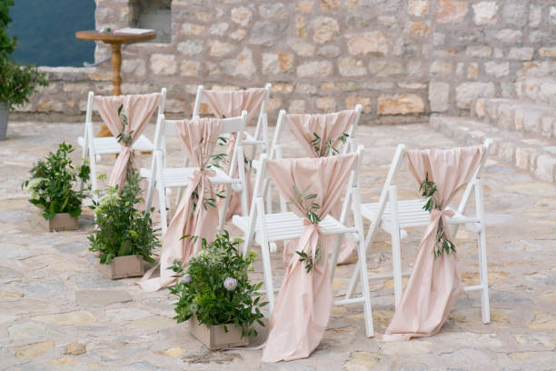 decorated chairs at the venue of the wedding ceremony