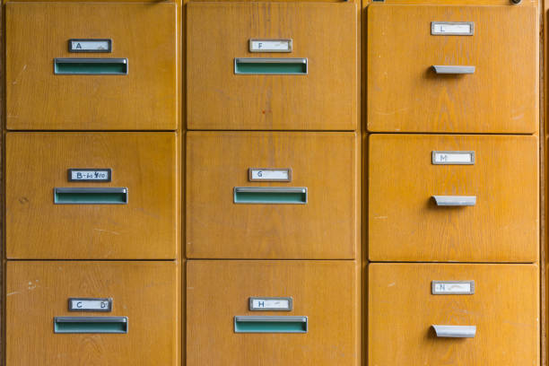 istock Wooden File Cabinet Straight On Geometric Pattern Squares Empty Labels Doors Closed Old Vintage Brown Office Supply 692499652
