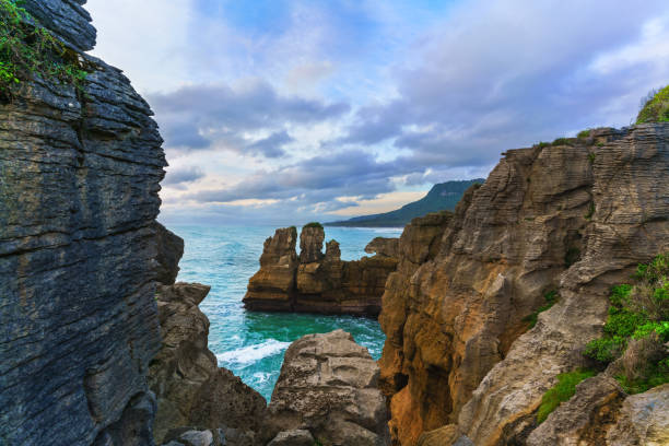 Beautiful Pancake Rocks and Blowholes are located in Paparoa National Park , Punakaiki , South Island of New Zealand Beautiful Pancake Rocks and Blowholes are located in Paparoa National Park , Punakaiki , South Island of New Zealand punakaiki stock pictures, royalty-free photos & images