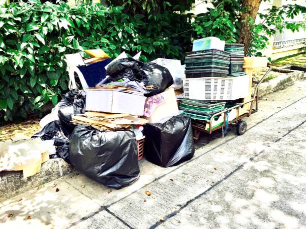 istock Pile of Cardboard Boxes and Plastic Waste 692509560