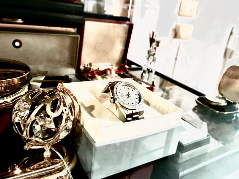 Time Management Concept, Classic and Luxury Silver with Jewelry Wristwatch in A Collectible Display Glass Cabinet.