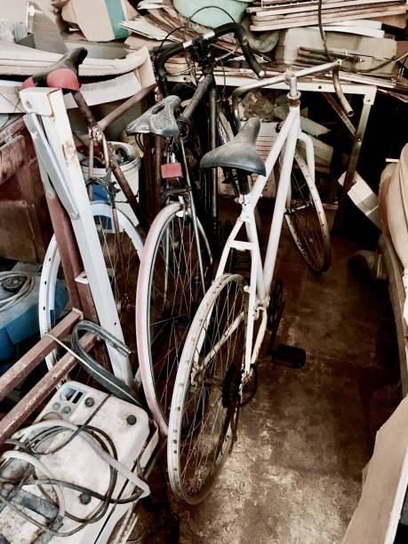 istock Old Broken Bicycles Parking in A Garage 692509818