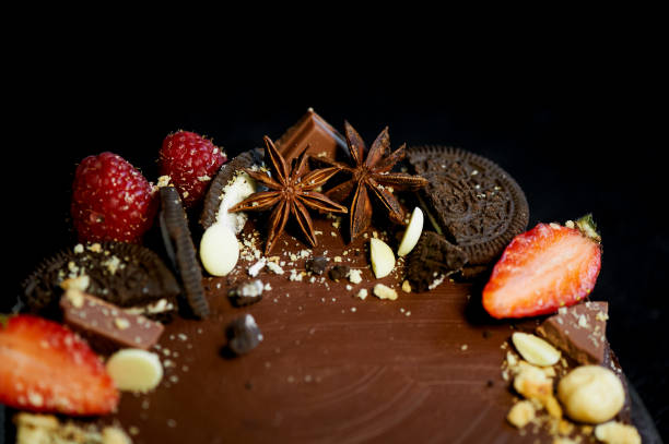 istock The chocolate cherry cake, decorated with strawberries, biscuits and strawberry shortcake. A masterpiece of culinary art 692520204
