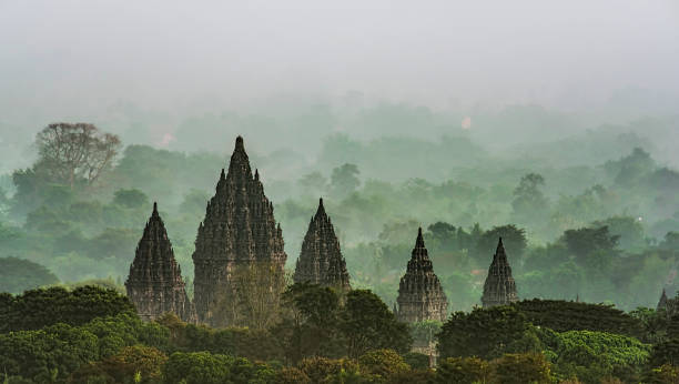 Prambanan Temple Prambanan temple viewed in foggy early morning. yogyakarta stock pictures, royalty-free photos & images