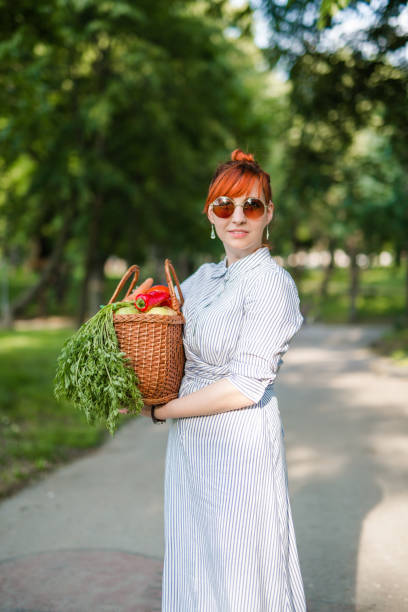 istock Young hipster woman gardening 692530602