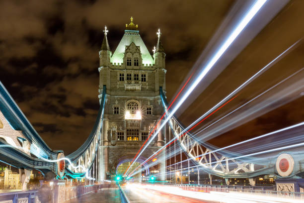 istock Light trails along Tower Bridge in London, UK 692532860