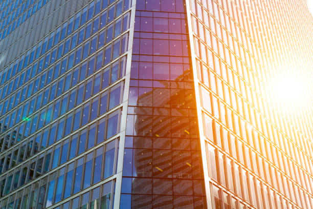 istock Cityscape featuring modern office exterior from a low angle at sunset. 692532920