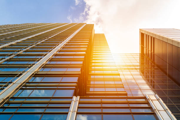 istock Cityscape featuring modern office exterior from a low angle at sunset. 692532948