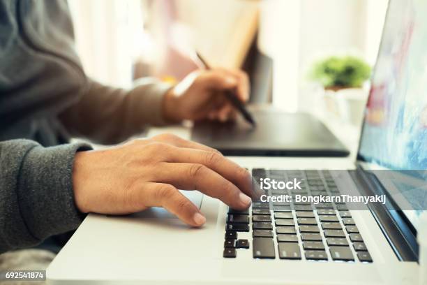 Creative And Designer Concept Man Using Graphic Tablet Stock Photo - Download Image Now