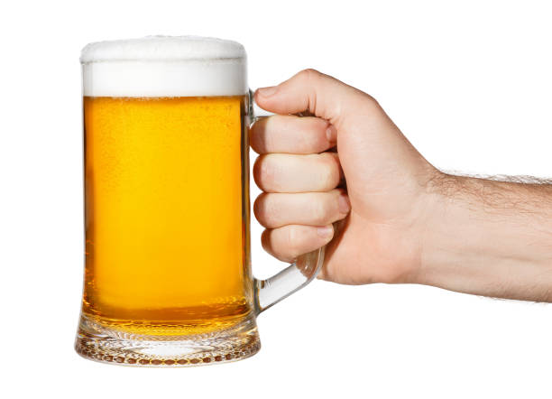 istock hand with mug of beer 692546278