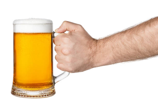 istock mug of beer in hand 692546302