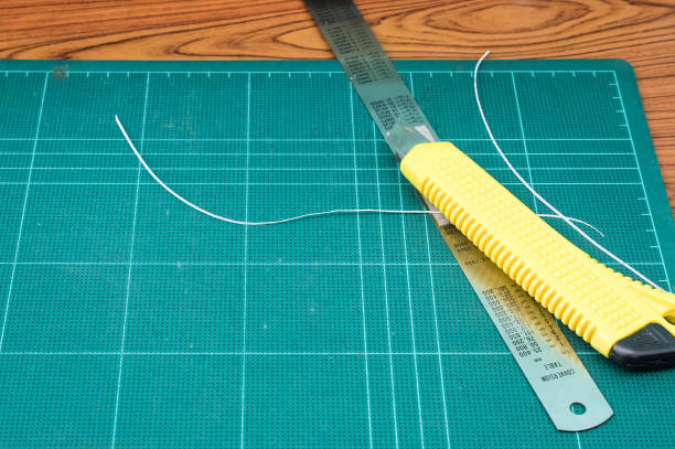 istock Yellow cutter and metal ruler. 692553150