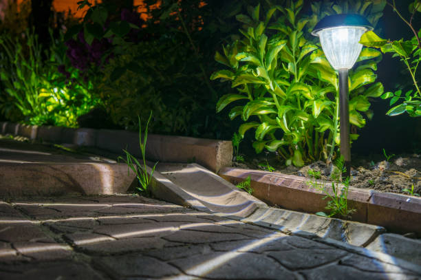 istock solar lanterns garden light with shrubs and tile at home 692553894