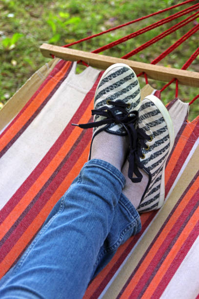 istock crossed legs in a hammock 692556626