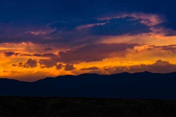 istock Vibrant Sunset and Clouds with Mountains Hills and Canyons 692570578