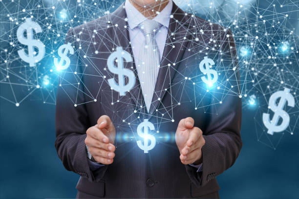 istock Businessman in network works with dollars. 692576666