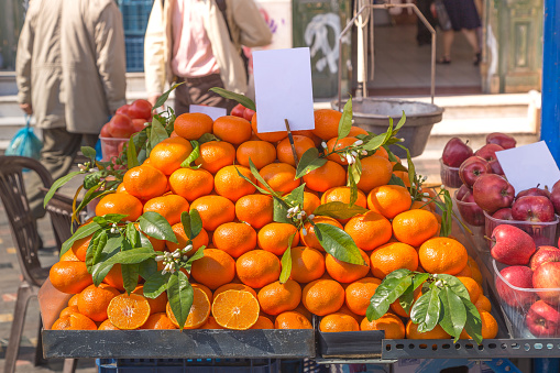 Fresh oranges on a street cart market in Athens, Greece.Concept for travel, urban and street life, fresh, healthy, raw, easy accessible food and small family business