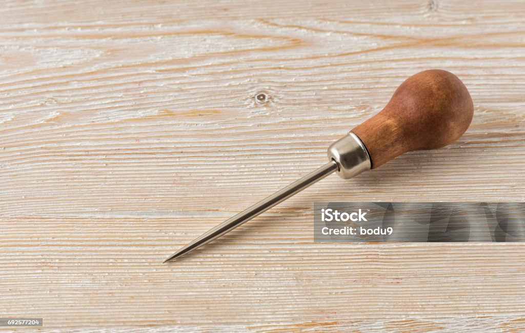 Shyla lying on a wooden table Pain lying on a wooden table Awl Stock Photo