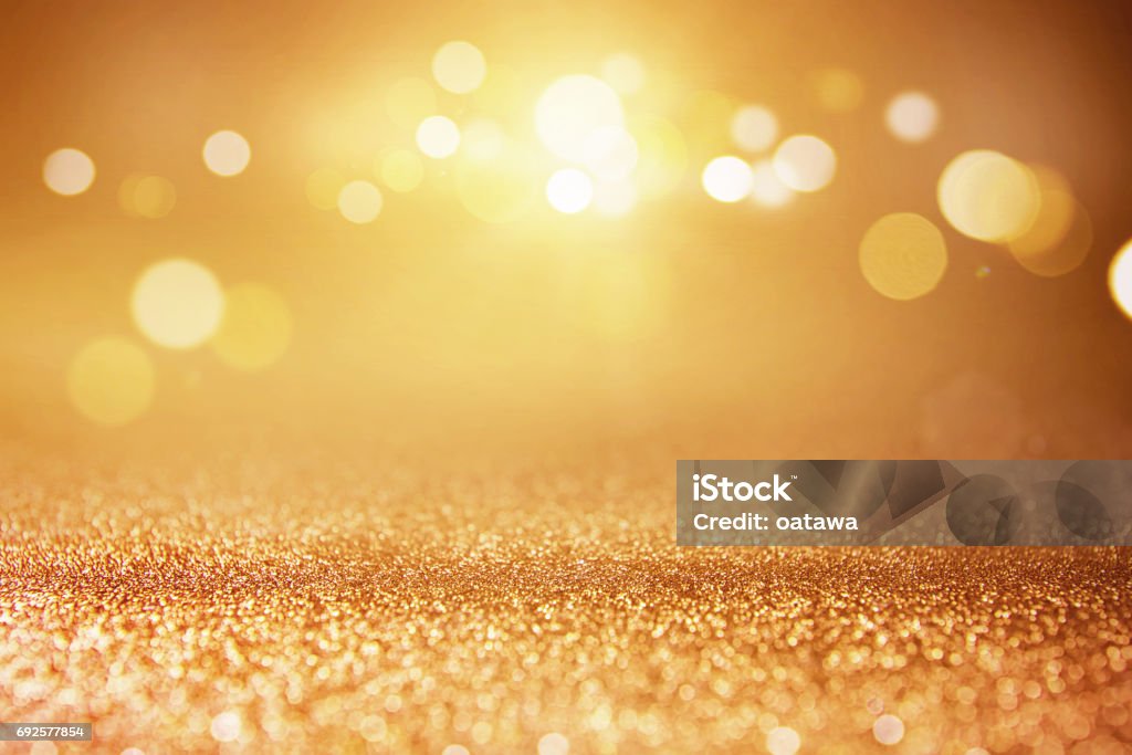 Gold glitter lights bokeh background. Gold glitter lights bokeh abstract background. defocused. Backgrounds Stock Photo