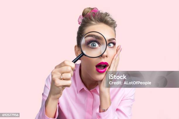 Woman Looking Through Magnifying Glass Stock Photo - Download Image Now - Magnifying Glass, Women, Loupe