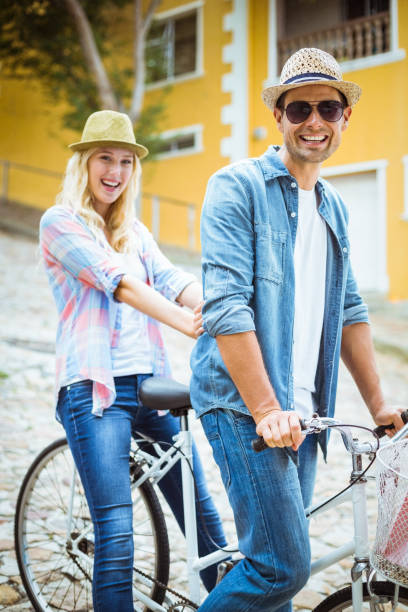 istock Hip young couple going for a bike ride 692578330