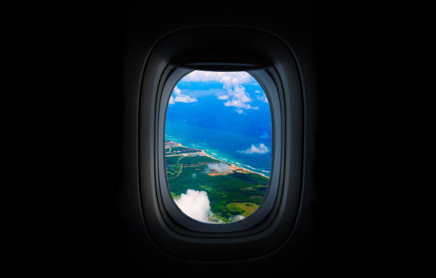 Costline, sea and sky from the airplane's Porthole. Dominican Republic
