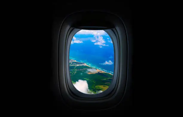 Photo of Costline, sea and sky from the plane's window