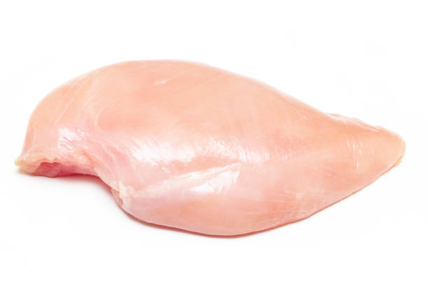 istock Raw chicken breast isolated on white background 692596360