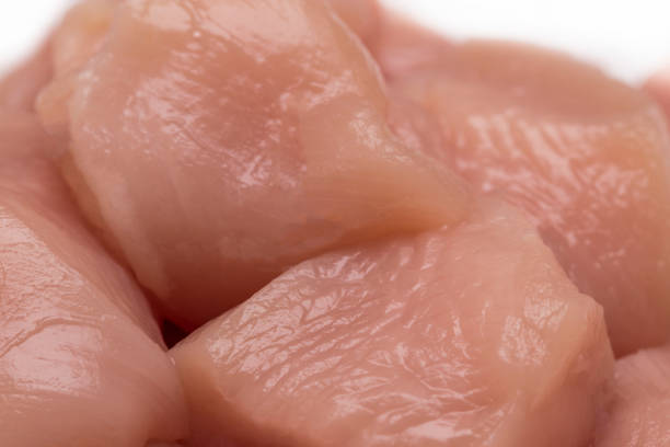 istock Top view of raw chicken fillet chunks isolated on white 692596924