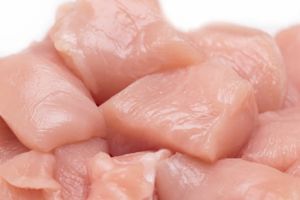 istock Top view of raw chicken fillet chunks isolated on white 692596930