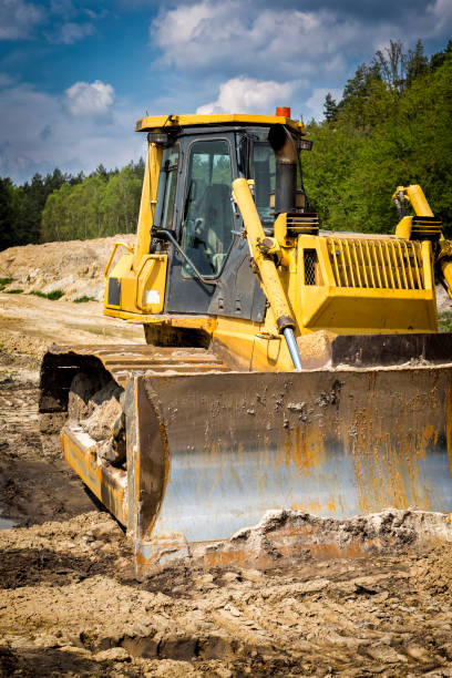 istock Yellow bulldozer on highway construction 692598732