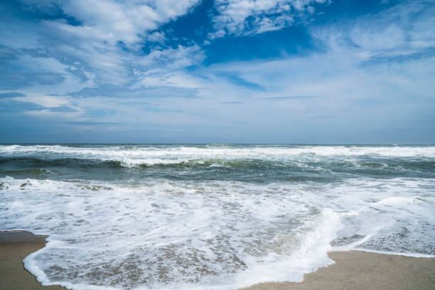 Kiss of the ocean Atlantic water is wiping the sand on Emerald Isle, NC. emerald isle north carolina stock pictures, royalty-free photos & images