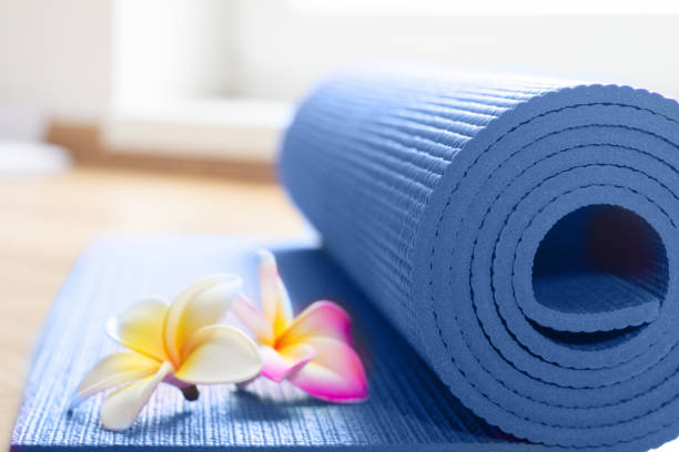 istock yoga mat with frangipani flowers 692599282