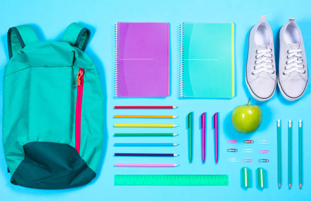 istock flat lay with various school supplies on colorful surface 692604466