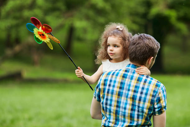 istock Dad and child are walking in the park 692607802