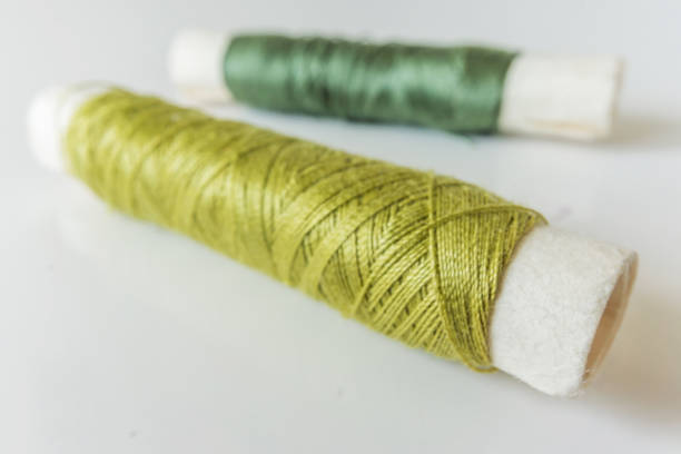 istock Close-up of a sewing set. Tailoring, pins, thimbles and spool with thread in different colors. Copy space. 692608530