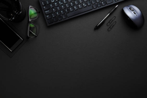 istock Office Supplies With Computer Keyboard And Mouse On Gray Desk 692614198