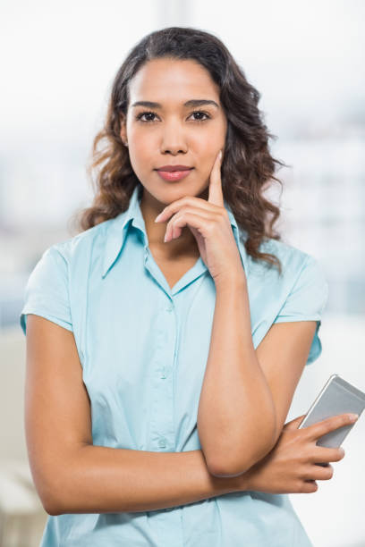 istock Businesswoman using her mobile phone 692621968