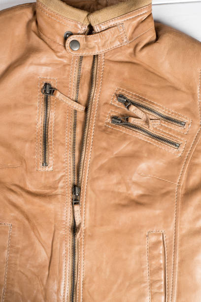istock Light brown leather jacket. Beige color leather jacket on hanger 692626958