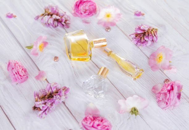 istock Bottles of perfume with flowers 692628052